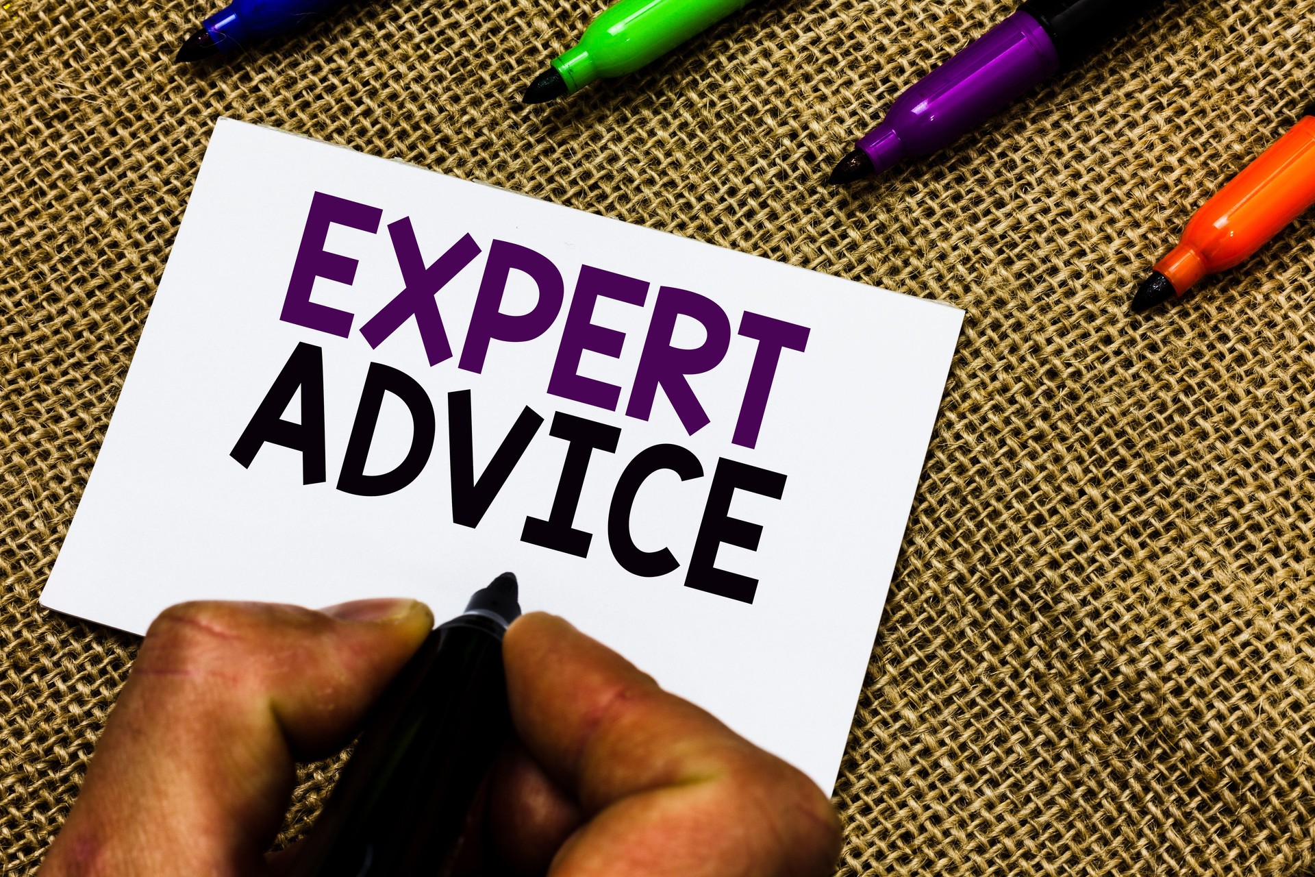 Writing note showing Expert Advice. Business photo showcasing Sage Good Word Professional opinion Extensive skill Ace Man hand holding marker white paper communicating idea Jute background.